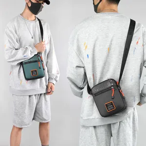 Waterproof nylon men's crossbody bag in army green and dark grey for outdoor sports