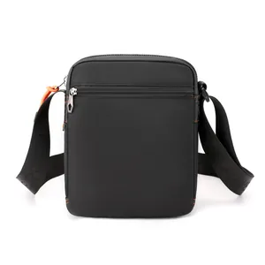 Waterproof nylon crossbody bag for men featuring orange stitching and Power embossed strap