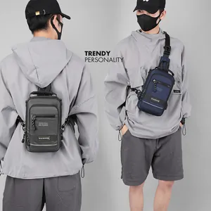 Men's functional sling bag in dark grey and navy blue with multiple zipper compartments