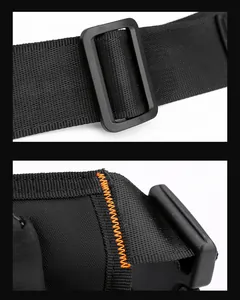 Detail of durable black nylon strap with orange reinforced stitching and plastic buckle
