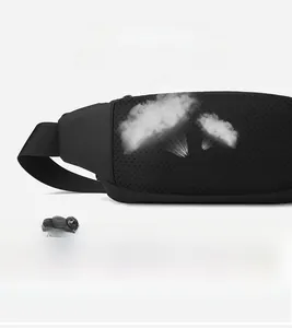 Detail of breathable honeycomb mesh back and adjustable strap on black sports waist bag