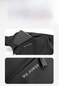 Macro view of waterproof black waist bag front pocket holding a large smartphone