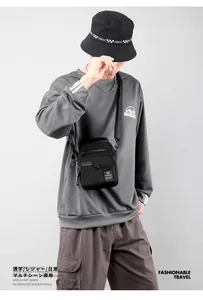 Waterproof nylon crossbody bag for men shown on a model in a trendy streetwear style
