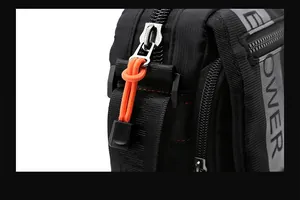 Close-up of black tactical crossbody bag with orange zipper detail and POWER print