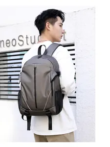 Outdoor shot showing side view of the waterproof travel backpack with adjustable straps