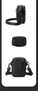Detail view of the black nylon mini bag showing rear belt loop and metal headphone port
