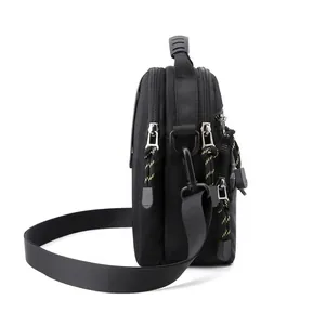 Black waterproof nylon messenger bag for men featuring multi-zipper compartments and strap