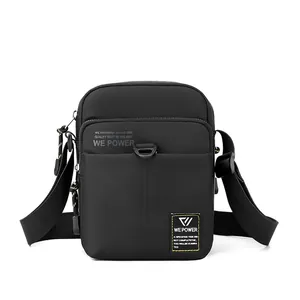 Mini black tactical nylon crossbody bag for men with adjustable strap on white background