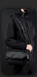 Detail of waterproof nylon crossbody bag featuring secure buckle and adjustable strap