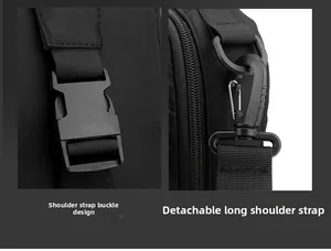 Close-up of durable plastic strap buckle and detachable metal spring hook on black nylon bag