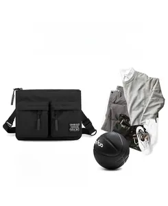 Detail of multi-functional black crossbody bag with dual zip pockets and adjustable straps