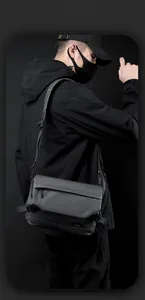 Detail of waterproof matte fabric and adjustable buckle on tactical messenger bag