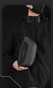 Detail of black waterproof crossbody bag with WE POWER logo and adjustable strap