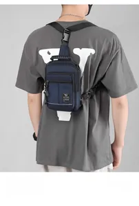 Rear view of a navy blue tactical chest bag made of durable nylon for daily travel