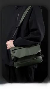 Macro view of olive green waterproof fabric with buckle and zipper detail