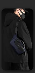 Detail of blue waterproof crossbody bag with adjustable strap and WE POWER logo