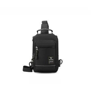 Detail view of black nylon chest bag showing USB charging port and reflective zipper