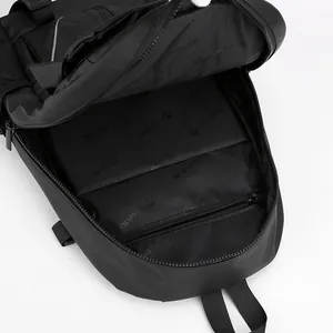 Internal view of waterproof travel backpack showing large main compartment and zipper pockets