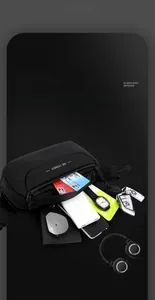 Detail of multi-compartment black crossbody chest bag showing organized storage space