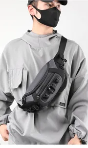 Tactical grey and black nylon crossbody bag featuring modular attachment points