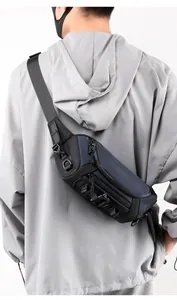 Detail of navy ballistic nylon tactical sling bag featuring multiple zip compartments