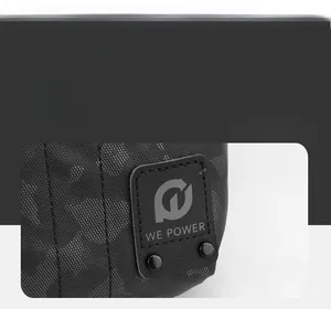 Détail du sac tactique camouflage noir avec logo WE POWER et rivets métalliques robustes