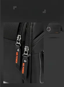 Detail showing smooth SBS double zippers with We Power rubber pulls on black nylon bag