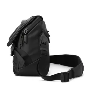 Men's black tactical crossbody bag with waterproof coating and wide shoulder strap