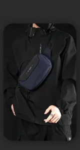 Detail of multi-functional navy nylon chest bag with WE POWER logo and reinforced strap