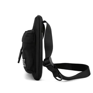 Side view of black durable nylon crossbody chest bag with adjustable strap for sports