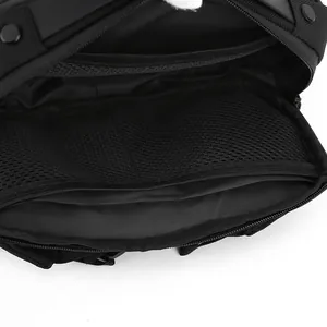 Interior view of black crossbody bag featuring mesh divider and multi-layer storage