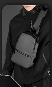Detail of waterproof crossbody bag showing side USB charging port and WEPOWER logo