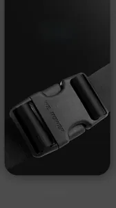 Detail of durable black plastic buckle with logo on nylon strap for tactical chest bag