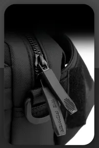 Macro view of durable dual zippers and waterproof nylon fabric on the commuter bag