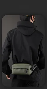 Army green nylon crossbody bag for men showing smart storage space and fit on back