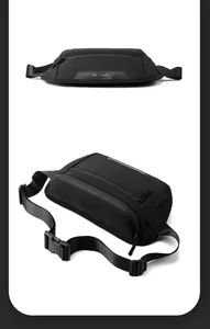 Close-up of black nylon chest bag featuring dual zippers and adjustable buckle straps