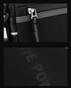 Détail du tissu en maille noire et de la fermeture éclair en métal pour sac homme
