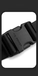 Detailed macro view of the durable plastic buckle and nylon webbing on a men's crossbody bag