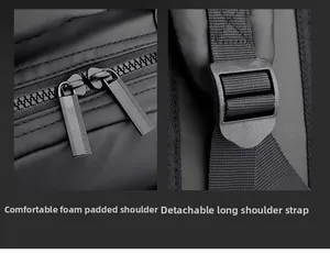 Detail of padded shoulder straps and dual zippers on a black nylon backpack