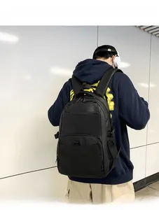 Minimalist black nylon backpack featuring spacious main compartment and sleek front zipper