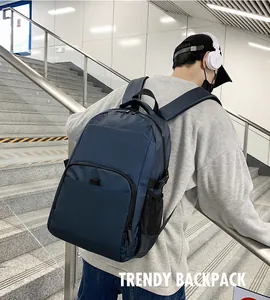 Close-up of navy blue nylon backpack featuring durable fabric and side mesh pocket detail