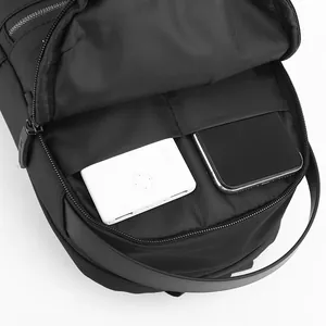 Black casual waterproof chest bag for men showing internal USB power bank storage slots