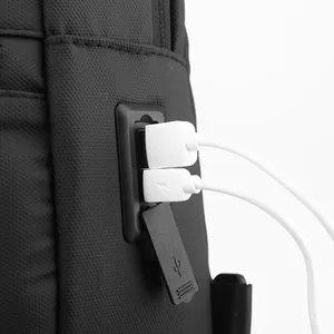 Waterproof black nylon chest bag with dual USB charging ports and protective cover