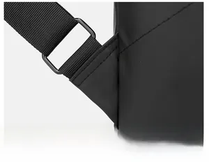 Macro shot of reinforced triangle stitching and metal buckle on waterproof backpack straps
