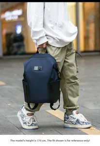 Waterproof blue casual backpack shown on a 175cm male model in a city street setting