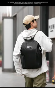 Detail of black waterproof casual backpack showing side zippers and large capacity