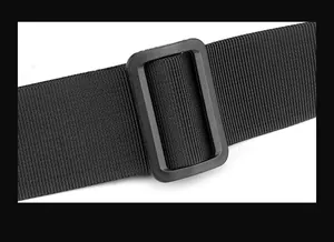 Detail of black nylon strap with an adjustable plastic buckle for men's shoulder bag
