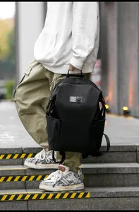 Men's casual black urban backpack with side zip pockets and a minimalist street style design