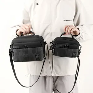 Black nylon shoulder bags in two sizes with camo patchwork and adjustable straps