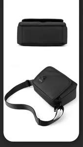 Macro detail of men's black crossbody bag featuring matte water-resistant fabric and flap